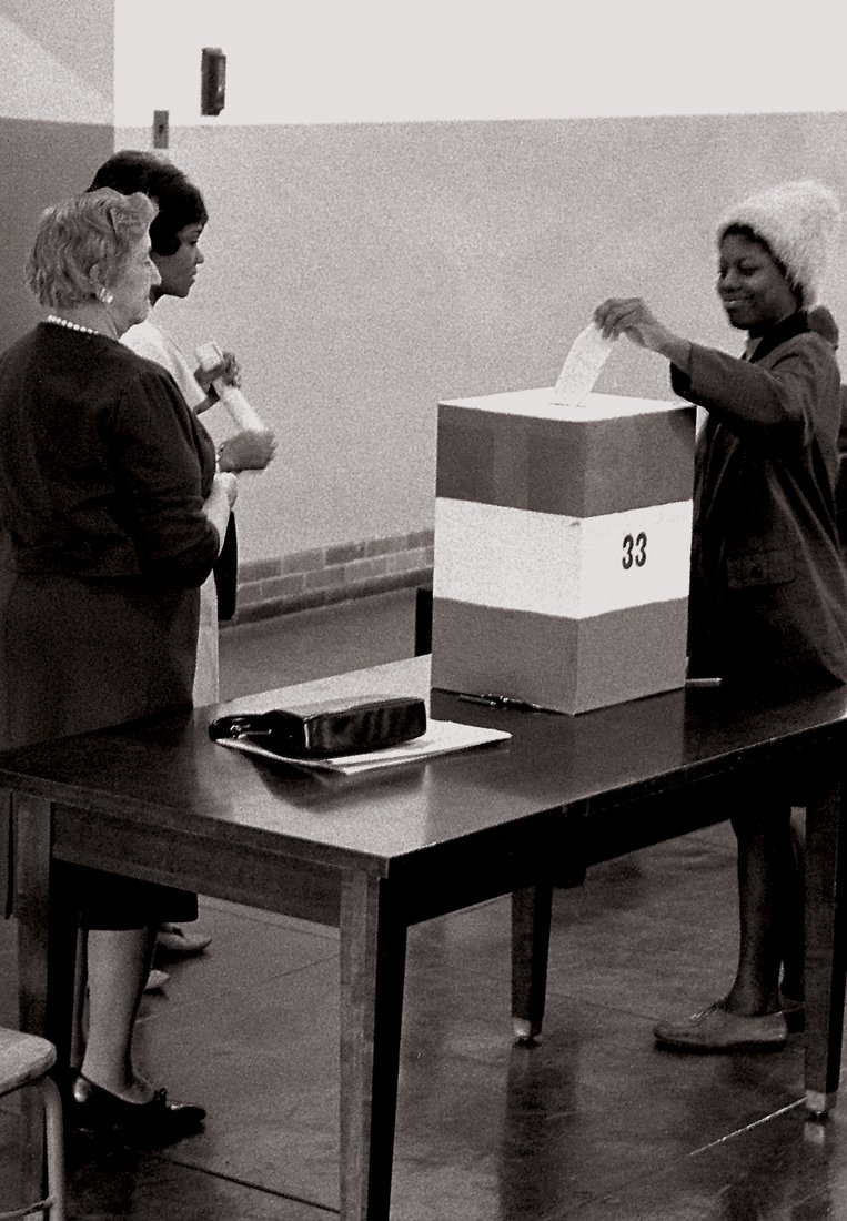 A young woman cast her ballot in the 1964 presidential election. Courtesy of the Library of Congress.